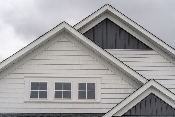 Front view of a typical mid-class home with white fascia