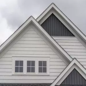Front view of a typical mid-class home with white fascia